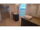 Double vanity bathroom with granite countertops and modern sinks at 312 Bianca Way, Mcdonough, GA 30253