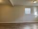 Finished basement room with neutral walls and laminate flooring at 6268 Marbut Farms Trl, Lithonia, GA 30058