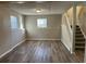 Finished basement with laminate floors and neutral walls at 6268 Marbut Farms Trl, Lithonia, GA 30058
