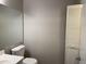 Simple bathroom with a toilet, sink, and mirrored medicine cabinet at 6268 Marbut Farms Trl, Lithonia, GA 30058