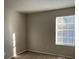 Bright bedroom with neutral walls and carpet at 6268 Marbut Farms Trl, Lithonia, GA 30058