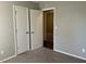 Spacious bedroom with two closets and neutral walls at 6268 Marbut Farms Trl, Lithonia, GA 30058