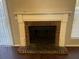 Brick fireplace with a white mantel in a living room setting at 6268 Marbut Farms Trl, Lithonia, GA 30058