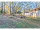 Large backyard with fire pit and mature trees at 2836 Hedgewood Nw Dr, Atlanta, GA 30311