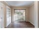 Bright dining room with built-in shelving and access to a sunroom at 2836 Hedgewood Nw Dr, Atlanta, GA 30311