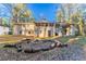 Ranch house back with screened porch and fire pit area at 2836 Hedgewood Nw Dr, Atlanta, GA 30311