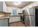 Modern kitchen with stainless steel appliances and granite countertops at 2836 Hedgewood Nw Dr, Atlanta, GA 30311
