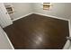 Spacious bedroom with dark hardwood flooring at 4887 Glenwood Rd, Decatur, GA 30035