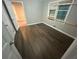 Well-lit bedroom featuring dark hardwood flooring at 4887 Glenwood Rd, Decatur, GA 30035