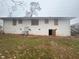 Brick ranch house with boarded windows needing renovations at 4887 Glenwood Rd, Decatur, GA 30035