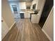 Renovated kitchen with new appliances and flooring at 4887 Glenwood Rd, Decatur, GA 30035