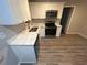 Modern kitchen featuring white cabinets and granite countertops at 4887 Glenwood Rd, Decatur, GA 30035