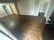 Spacious living area with dark hardwood flooring at 4887 Glenwood Rd, Decatur, GA 30035