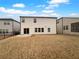 Home's backyard with grassy lawn and a patio at 422 Mcdaniel Pl, Canton, GA 30115