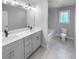 Bathroom with double vanity and a tub at 422 Mcdaniel Pl, Canton, GA 30115
