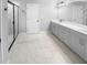Bathroom with double vanity, marble-look flooring, and large shower at 422 Mcdaniel Pl, Canton, GA 30115
