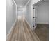 Long hallway with light walls and wood-look flooring at 422 Mcdaniel Pl, Canton, GA 30115
