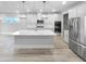 Modern kitchen with white cabinets, large island, and stainless steel appliances at 422 Mcdaniel Pl, Canton, GA 30115