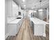 Modern kitchen with white cabinets, quartz counters, and stainless steel appliances at 422 Mcdaniel Pl, Canton, GA 30115