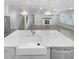 Modern kitchen island with farmhouse sink and quartz countertops at 422 Mcdaniel Pl, Canton, GA 30115