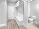 Convenient laundry room with built-in bench and storage at 422 Mcdaniel Pl, Canton, GA 30115