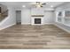 Spacious living room featuring hardwood floors and a fireplace at 422 Mcdaniel Pl, Canton, GA 30115