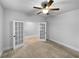 Office with french doors and neutral colored carpet at 422 Mcdaniel Pl, Canton, GA 30115