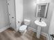 Stylish powder room with pedestal sink and elegant fixtures at 422 Mcdaniel Pl, Canton, GA 30115