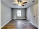 Bright bedroom with hardwood floors, ceiling fan, and window at 2835 Laguna Dr, Decatur, GA 30032
