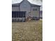 House exterior showcasing a screened porch and grassy backyard at 2513 Colin Pl, Mcdonough, GA 30253