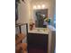 Bright bathroom with vanity, mirror, and flowers at 2513 Colin Pl, Mcdonough, GA 30253