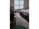 Bright bedroom with large window, carpeted floor, and a double bed at 2513 Colin Pl, Mcdonough, GA 30253