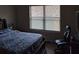 Bedroom with a large bed, window with blinds, and gaming chair at 2513 Colin Pl, Mcdonough, GA 30253