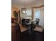 Round dining table with six chairs, situated near a window at 2513 Colin Pl, Mcdonough, GA 30253