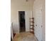 Hallway with tile flooring and wooden shelves at 2513 Colin Pl, Mcdonough, GA 30253