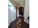 Elegant hallway with dark hardwood floors, leading to living room at 2513 Colin Pl, Mcdonough, GA 30253
