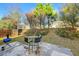 Small patio with seating area and grill, overlooking a fenced backyard at 3282 Victoria Sw Park, Atlanta, GA 30331