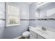 Clean bathroom with white vanity, tile flooring, and a decorative mosaic at 3282 Victoria Sw Park, Atlanta, GA 30331