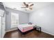 Bright bedroom featuring a pink mattress, hardwood floors, and a ceiling fan at 3282 Victoria Sw Park, Atlanta, GA 30331