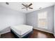 Serene bedroom with a comfortable bed, hardwood floors, and a ceiling fan at 3282 Victoria Sw Park, Atlanta, GA 30331