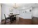 Open dining room with kitchen bar and chandelier at 3282 Victoria Sw Park, Atlanta, GA 30331