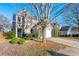 Two-story house with a tree in front and a two-car garage at 3282 Victoria Sw Park, Atlanta, GA 30331