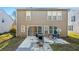 Tan two story house with sliding glass doors leading to a patio at 3282 Victoria Sw Park, Atlanta, GA 30331
