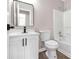 Updated bathroom with white vanity, quartz countertop, and modern fixtures at 2023 Downs Pl, Lithonia, GA 30058