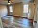 Spacious bedroom with wood-look flooring and large windows at 6076 Belle Meade Dr, Villa Rica, GA 30180
