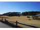 Scenic golf course with a wooden fence and pavilion at 6076 Belle Meade Dr, Villa Rica, GA 30180