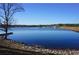 Calm lake view with a small dock at 6076 Belle Meade Dr, Villa Rica, GA 30180