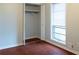 Bright bedroom with hardwood floors and closet at 679 Winchester Ln, Norcross, GA 30071