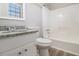 Clean bathroom with granite countertop, white vanity, and tub shower at 100 Spicewood Ct, South Fulton, GA 30349
