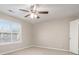 Bright bedroom with ceiling fan, neutral walls, and carpeted floor at 100 Spicewood Ct, South Fulton, GA 30349
